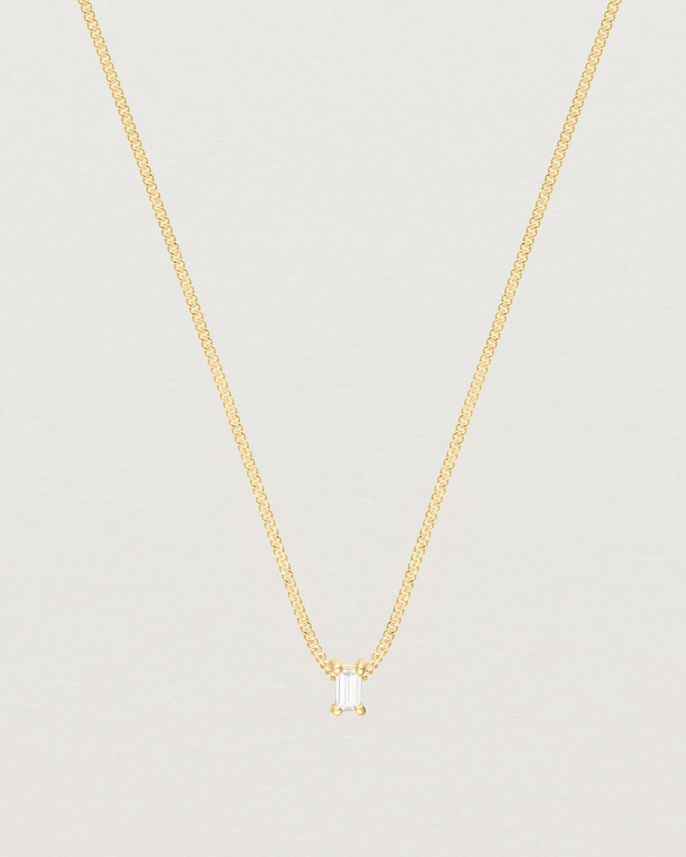 Close up of the Sena Slider Necklace with White Diamond in yellow gold.