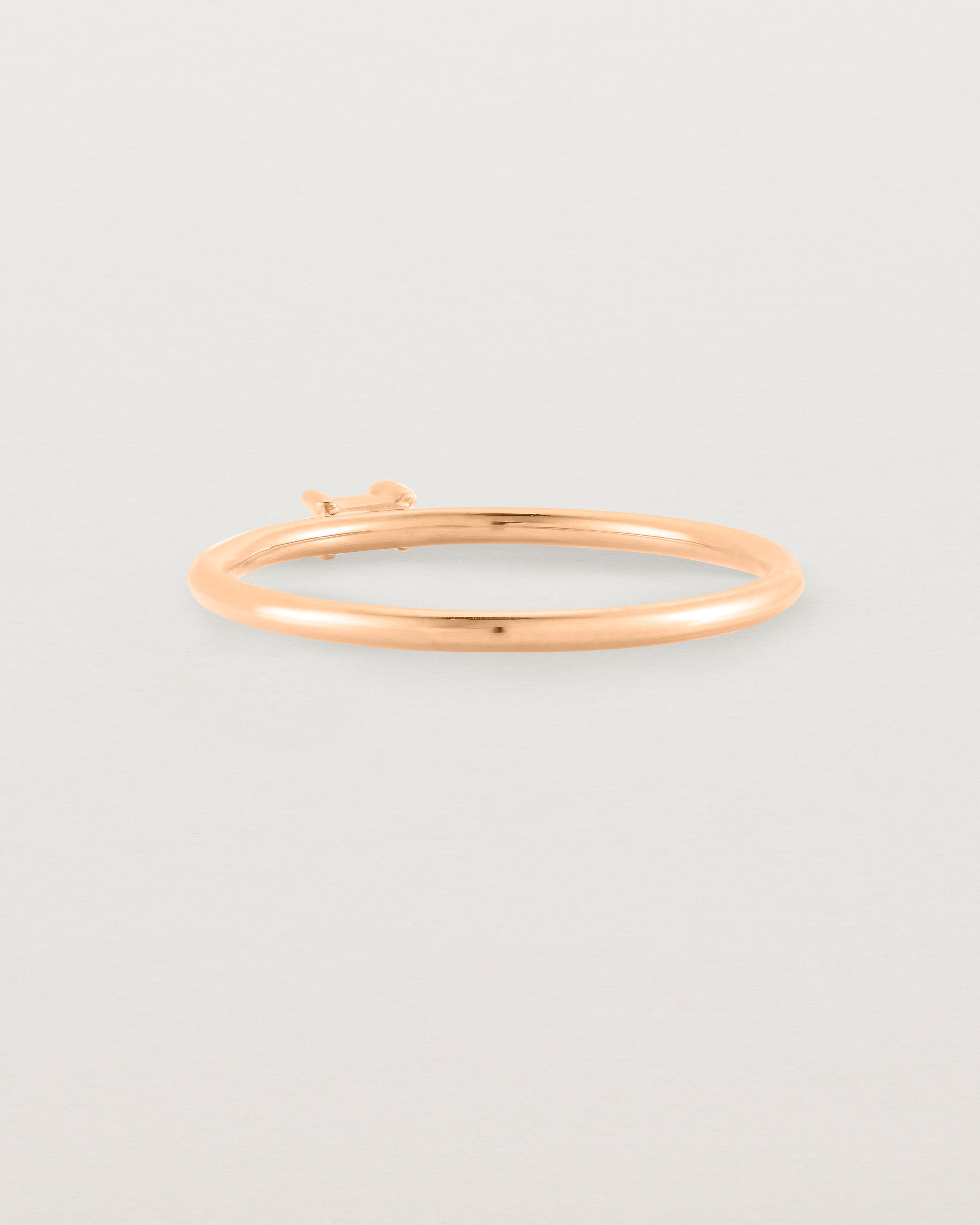 Fine rose gold ring with a champagne coloured helidor stone