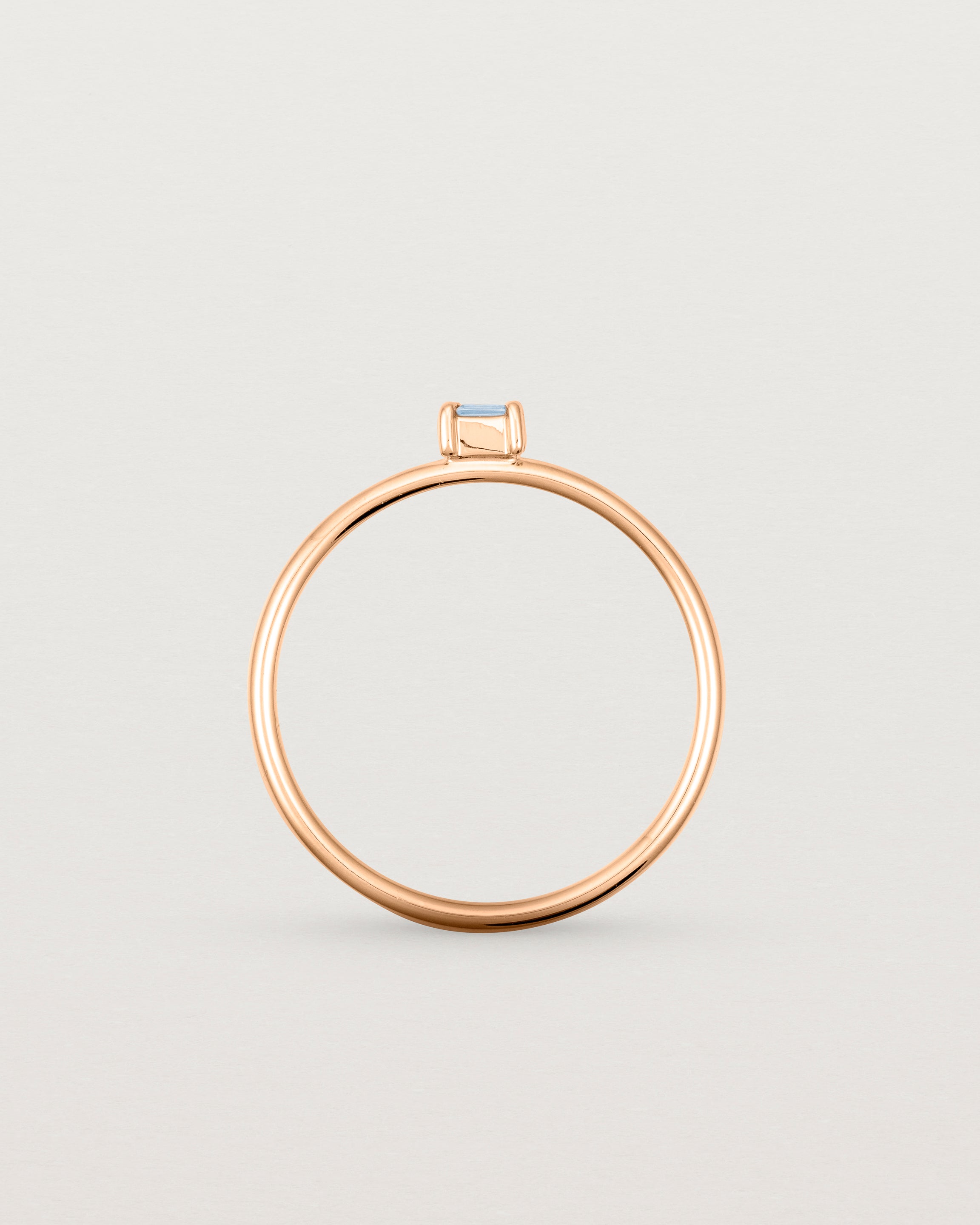 Fine rose gold ring with a champagne coloured helidor stone