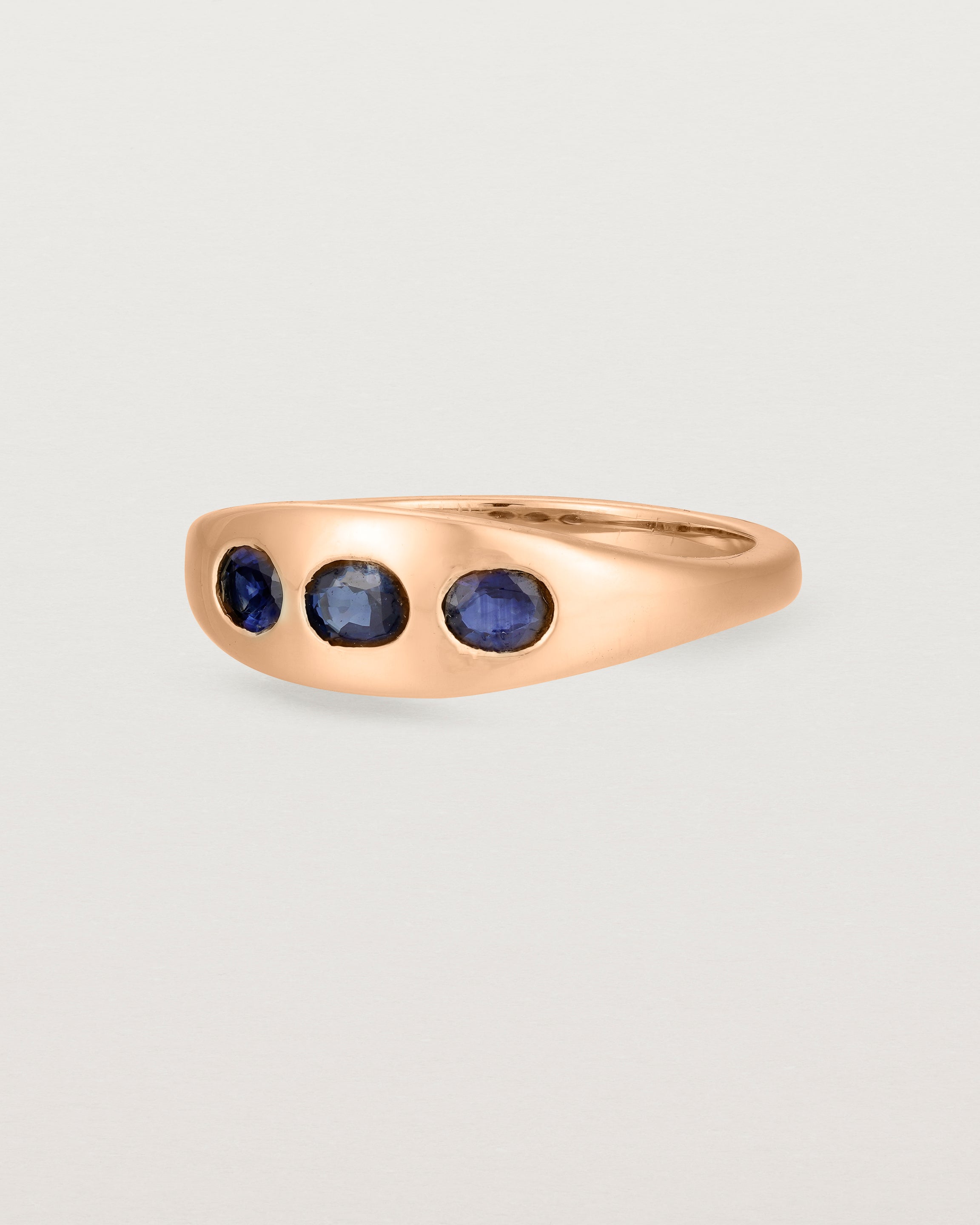 Angled view of the Seule Trinity Ring | Australian Sapphires | Rose Gold.