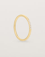 Standinf view of the Six Stone Queenie Ring | Diamonds in Yellow Gold.