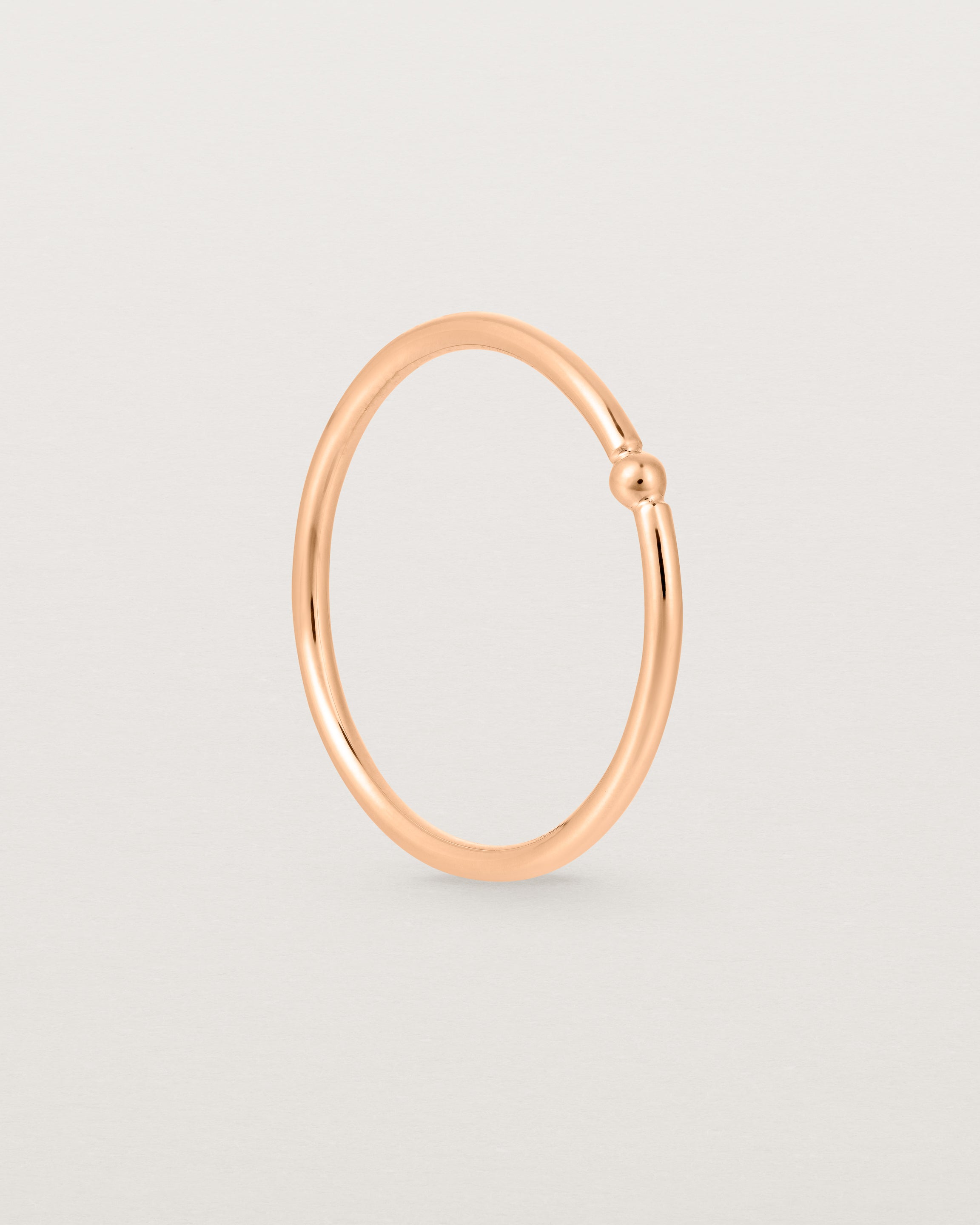 Standing view of the Suspend Ring in Rose Gold.