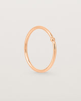 Standing view of the Suspend Ring in Rose Gold.