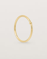 Standing view of the Suspend Ring in Yellow Gold.