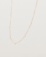 Angled view of the Tellue Necklace in rose gold.