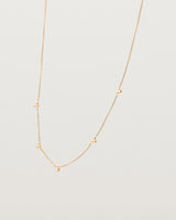 Angled view of the Tellue Necklace in rose gold.