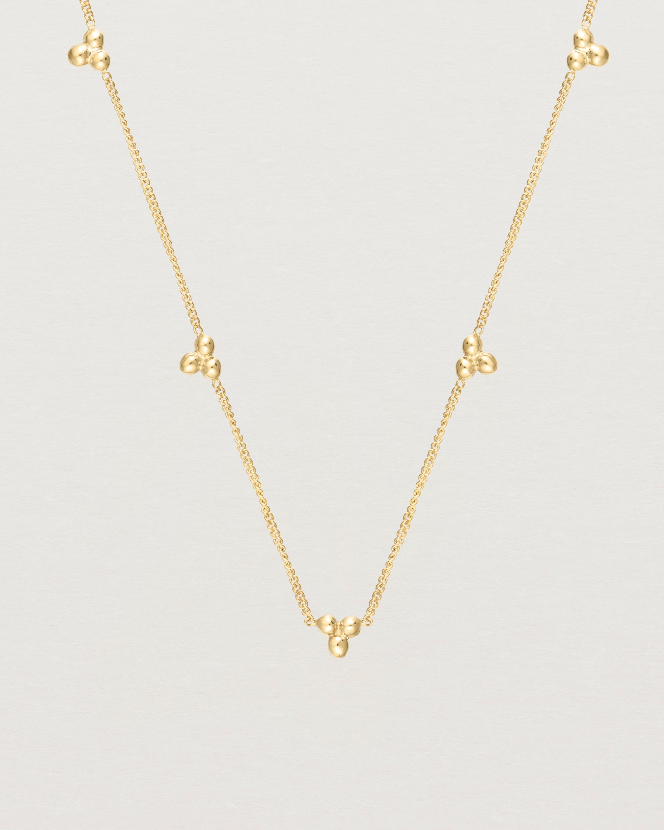 Close up of the Tellue Necklace in yellow gold.