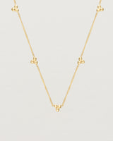 Close up of the Tellue Necklace in yellow gold.