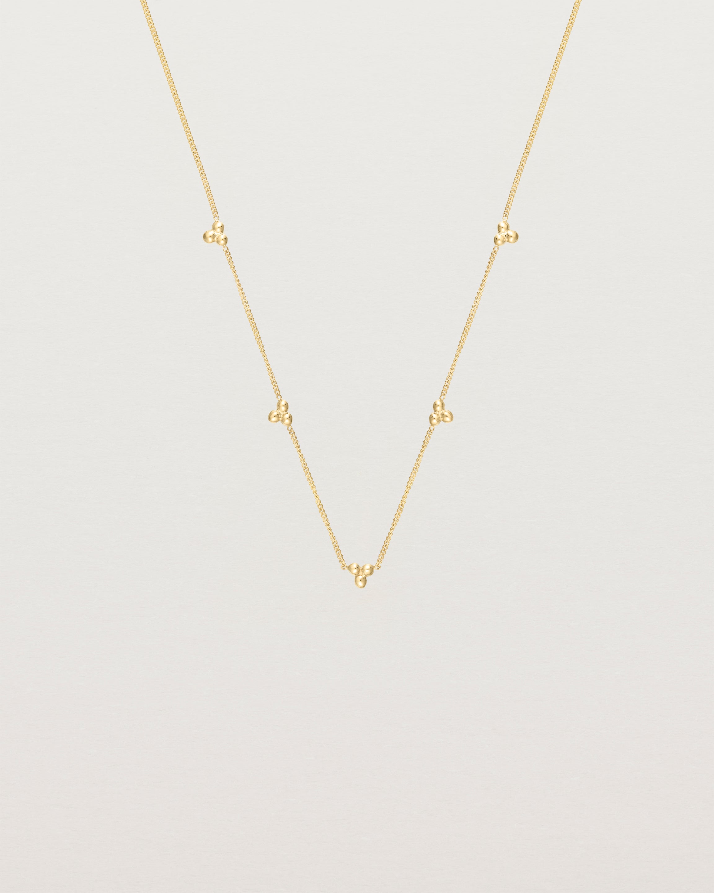 Front view of the Tellue Necklace in yellow gold.