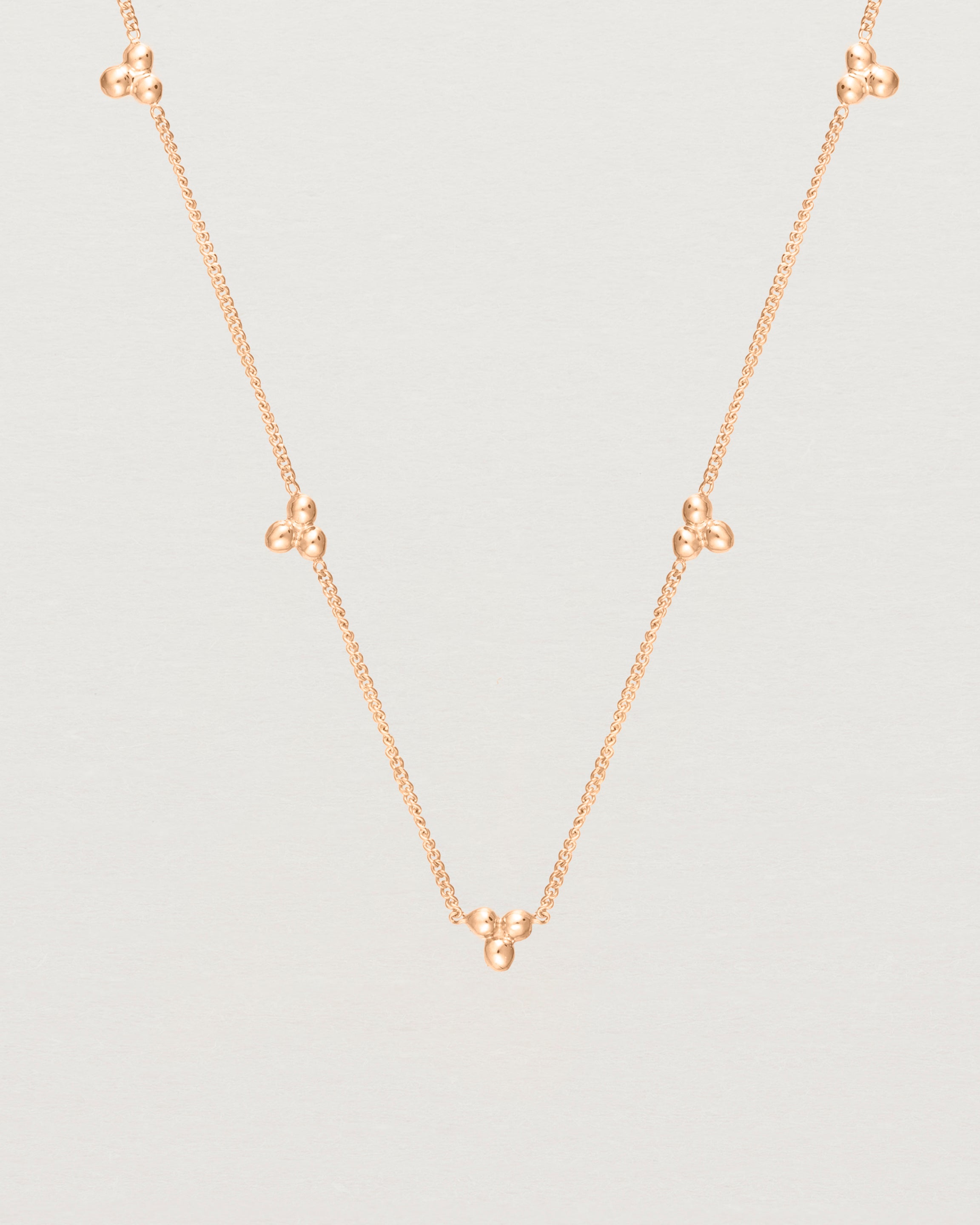 Close up of the Tellue Necklace in rose gold.