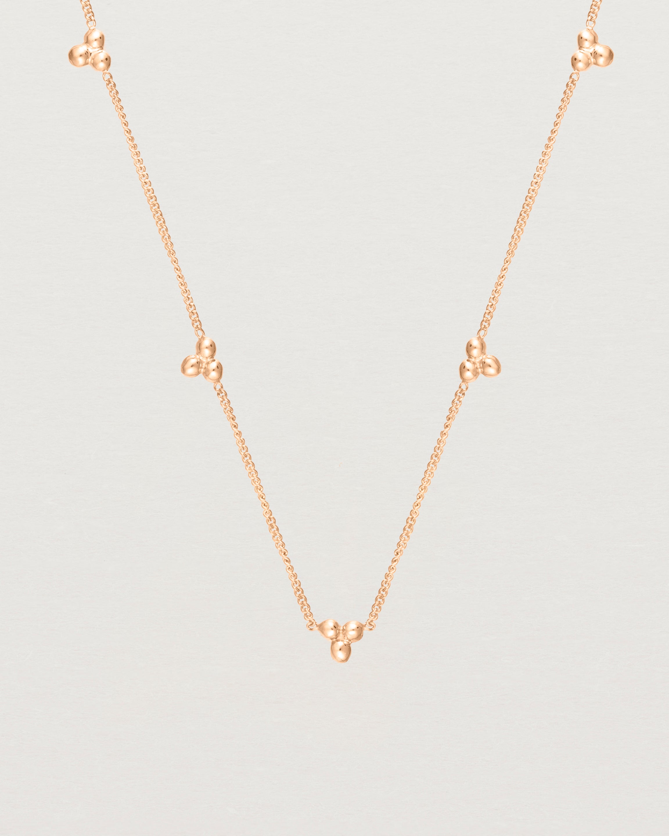 Close up of the Tellue Necklace in rose gold.