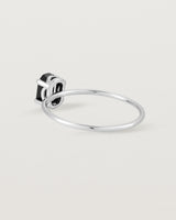 Fine sterling silver band featuring an oval black spinel stone