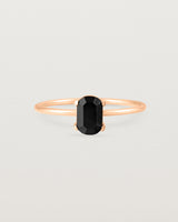 Fine rose gold band featuring an oval black spinel stone