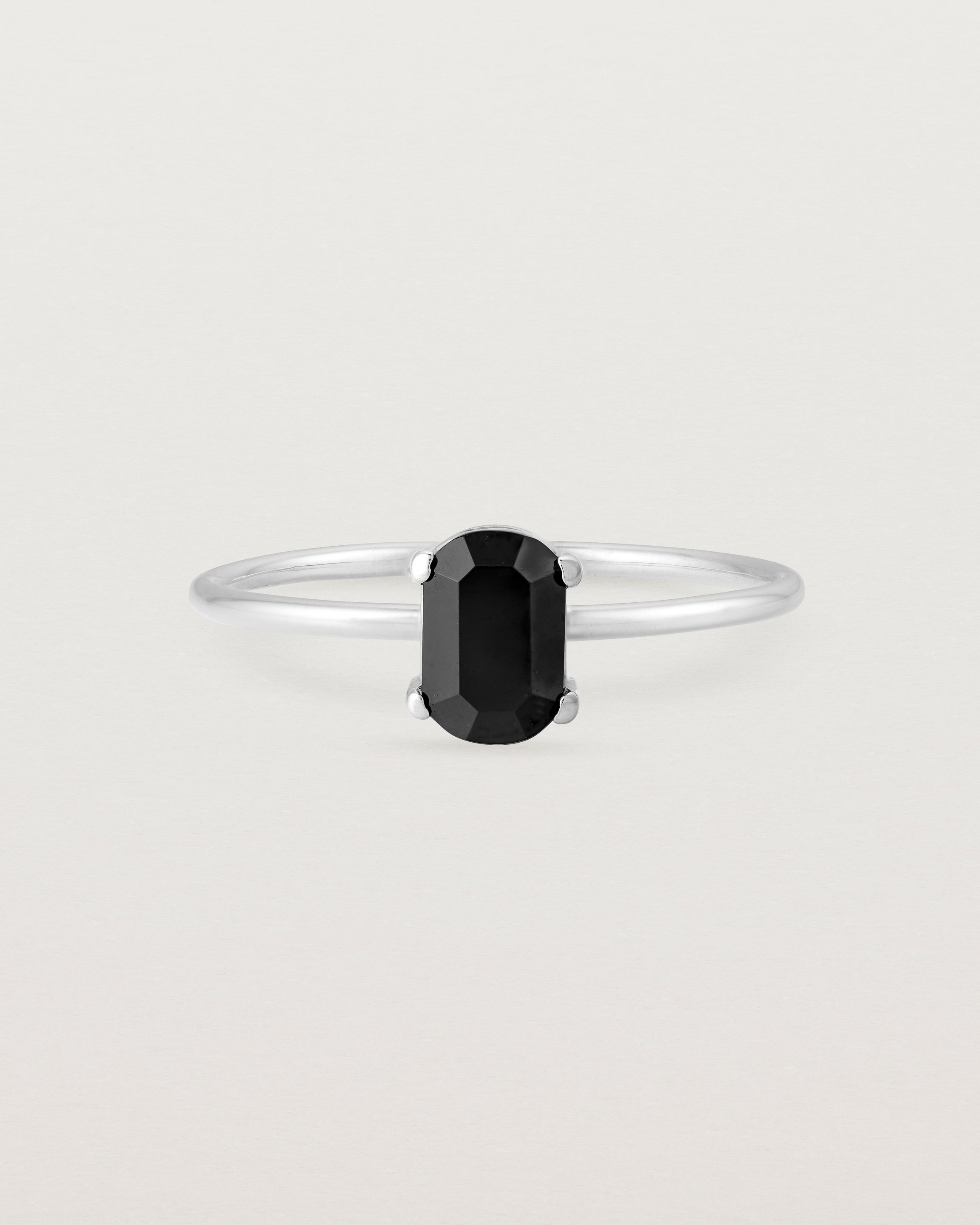 Fine sterling silver band featuring an oval black spinel stone