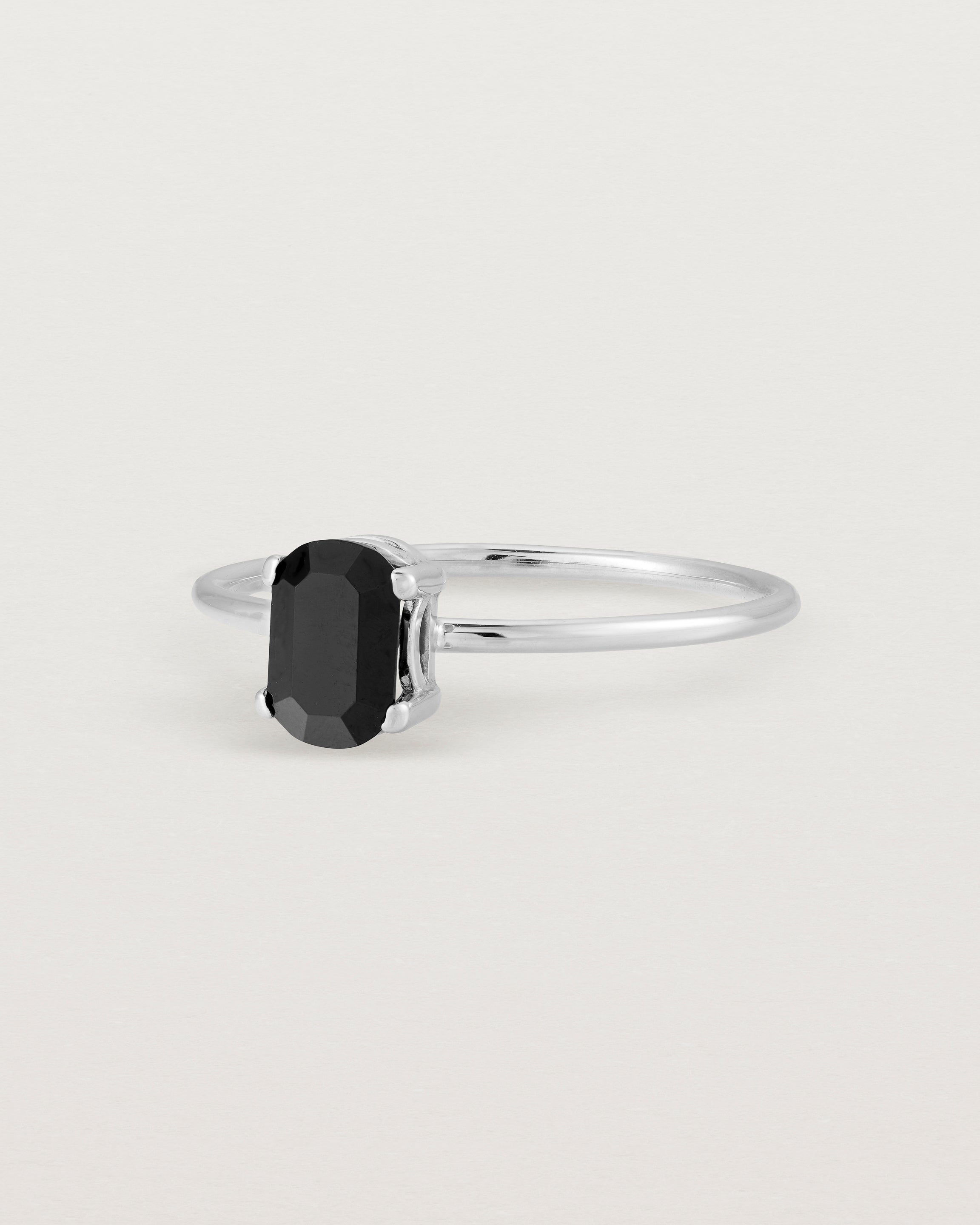 Fine sterling silver band featuring an oval black spinel stone