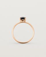 Fine rose gold band featuring an oval black spinel stone