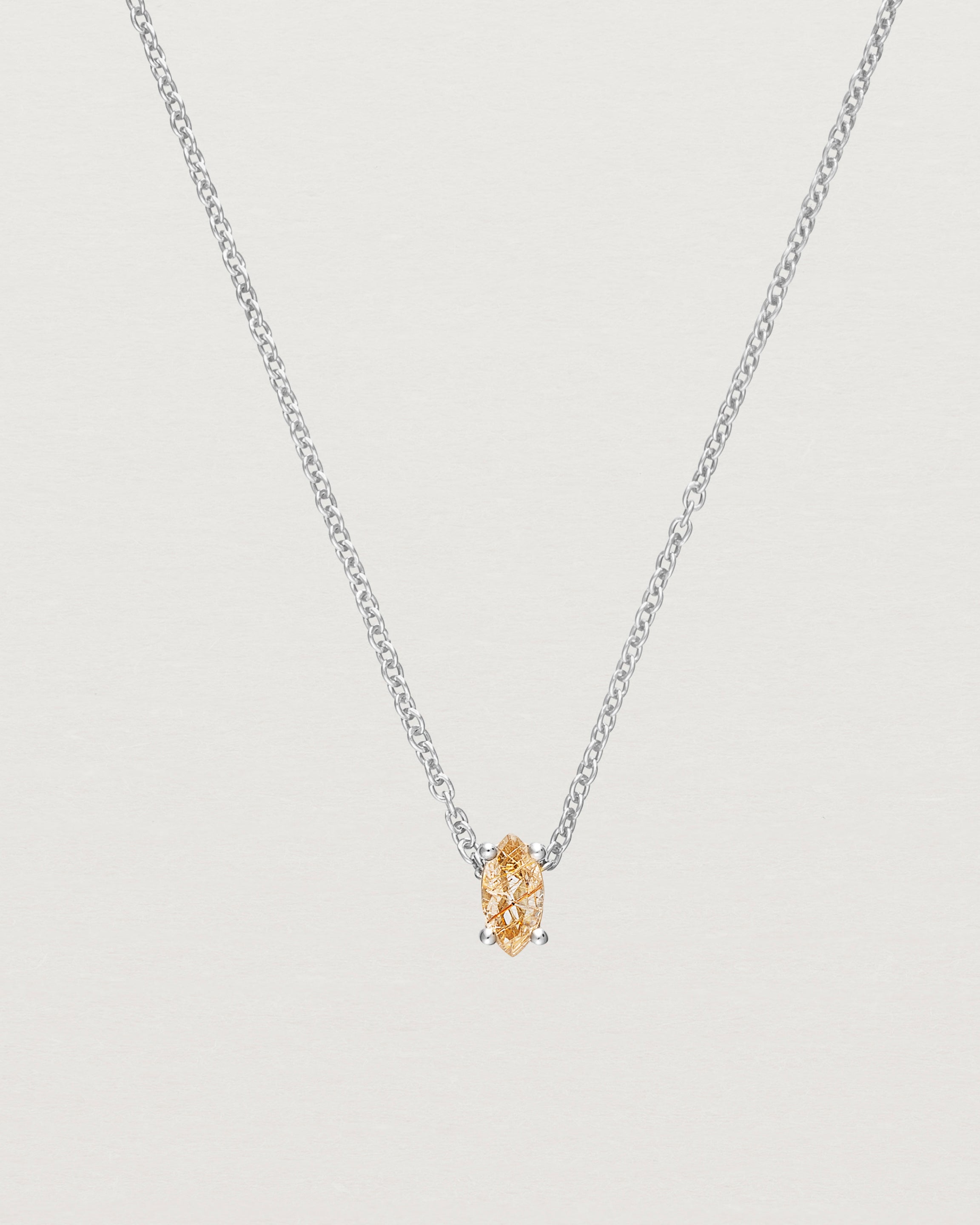 Close up of the Tiny Marquise Necklace with Rutilated Quartz in sterling silver.