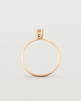 Fine rose gold band featuring a marquise cut brown rutilated quartz stone