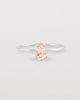 A fine white gold ring featuring a pear shaped pink morganite stone