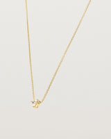 Angled view of the Tiny Trillion Necklace with Heliodor in Yellow Gold.