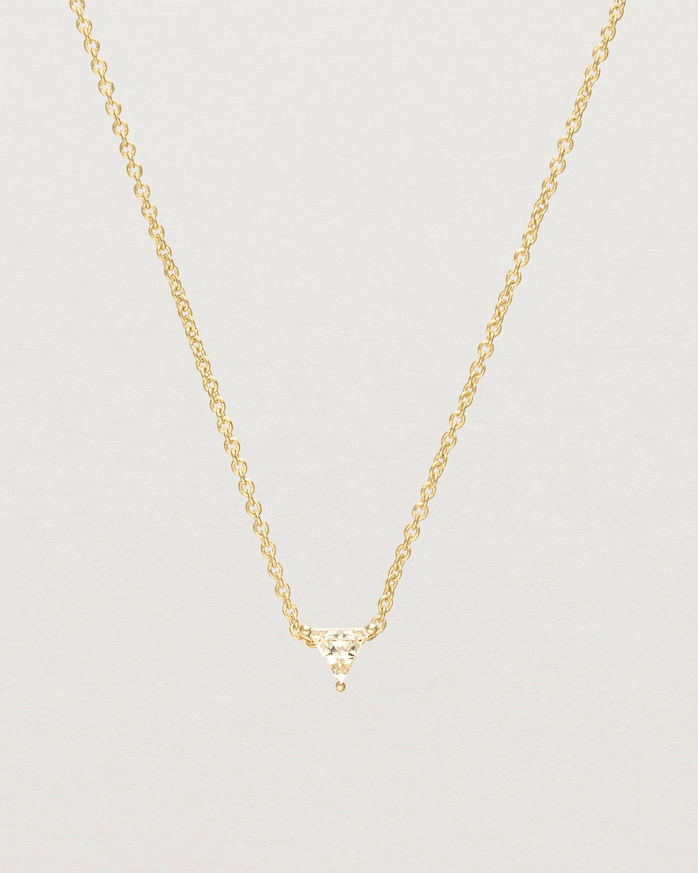 Close up of the Tiny Trillion Necklace with Heliodor in Yellow Gold.