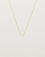 Front view of the Tiny Trillion Necklace with Heliodor in Yellow Gold.