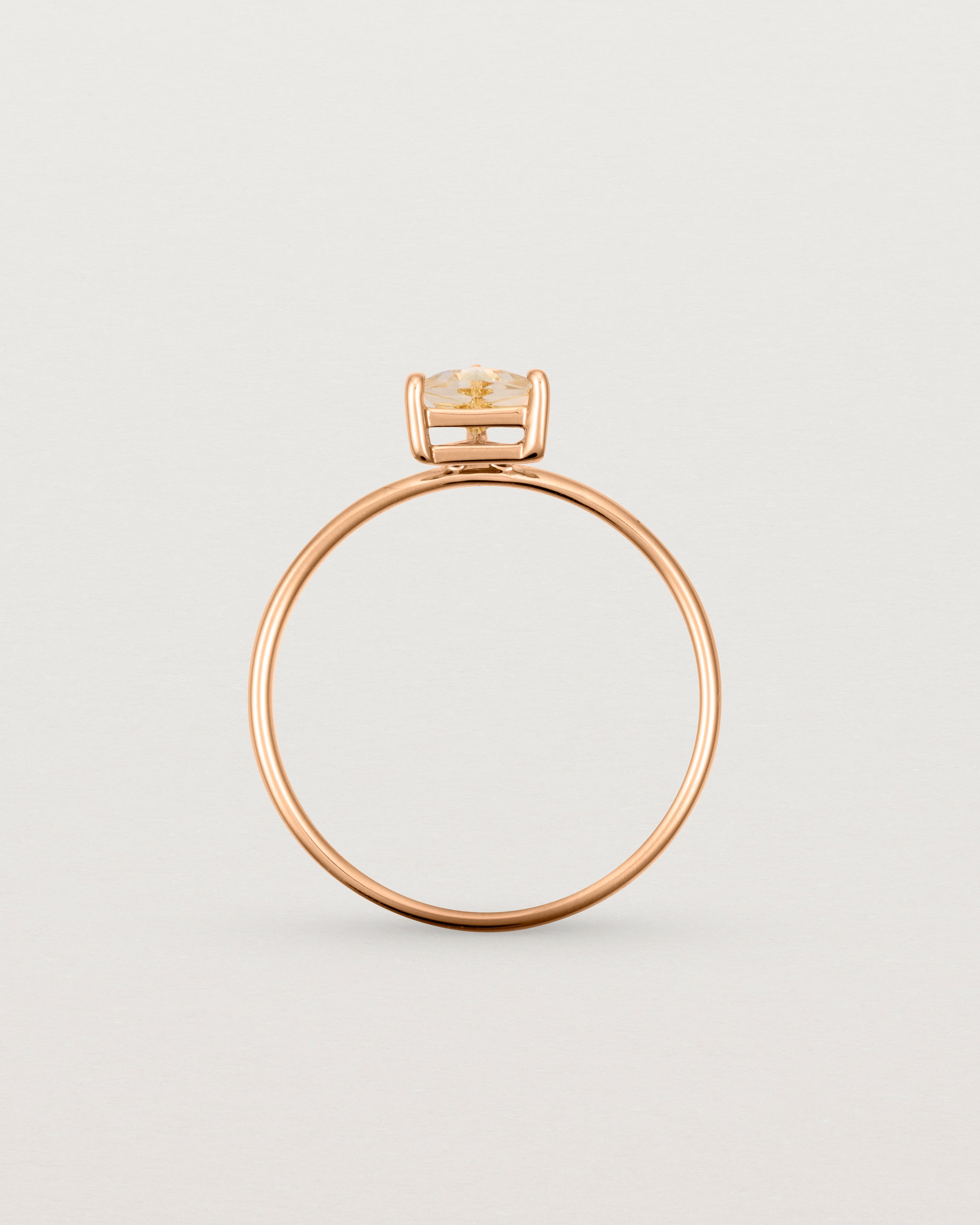 fine rose gold ring featuring a champagne yellow helidor stone