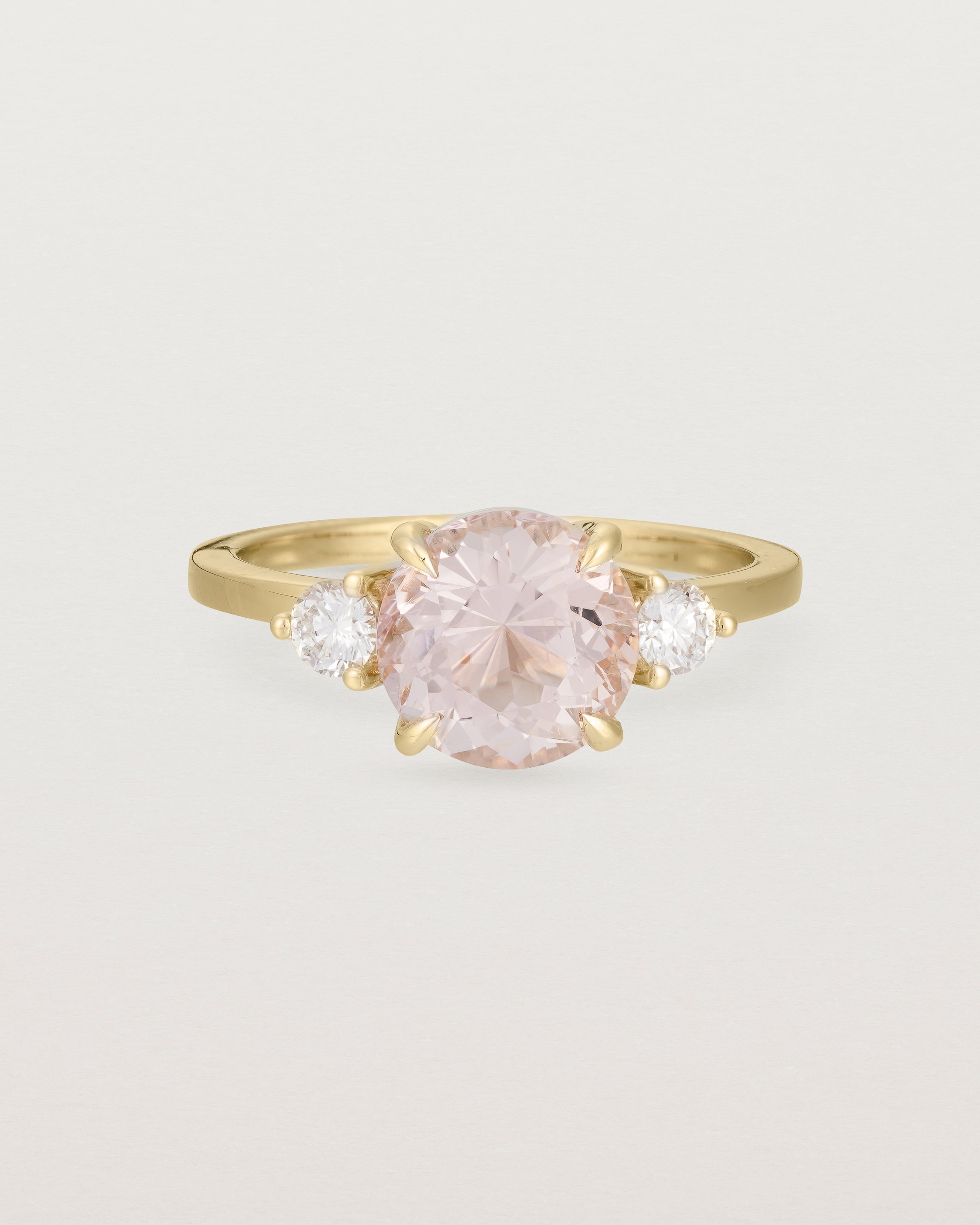 Front view of the Una Round Trio Ring | Morganite & Diamonds | Yellow Gold. 