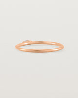 Fine rose gold stacking ring featuring a white marquise centre diamond