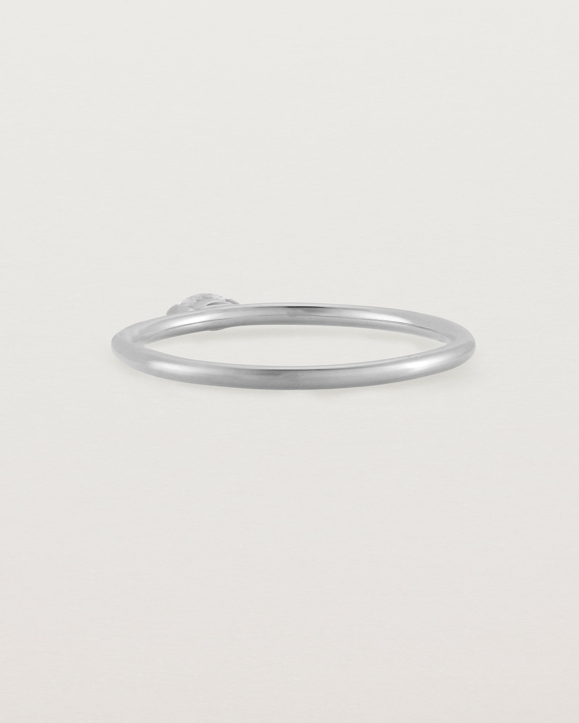 Fine white gold stacking ring featuring a white marquise centre diamond