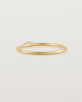 Fine yellow gold stacking ring featuring a white marquise centre diamond