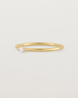 Fine yellow gold stacking ring featuring a white marquise centre diamond