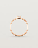 Fine rose gold stacking ring featuring a white marquise centre diamond