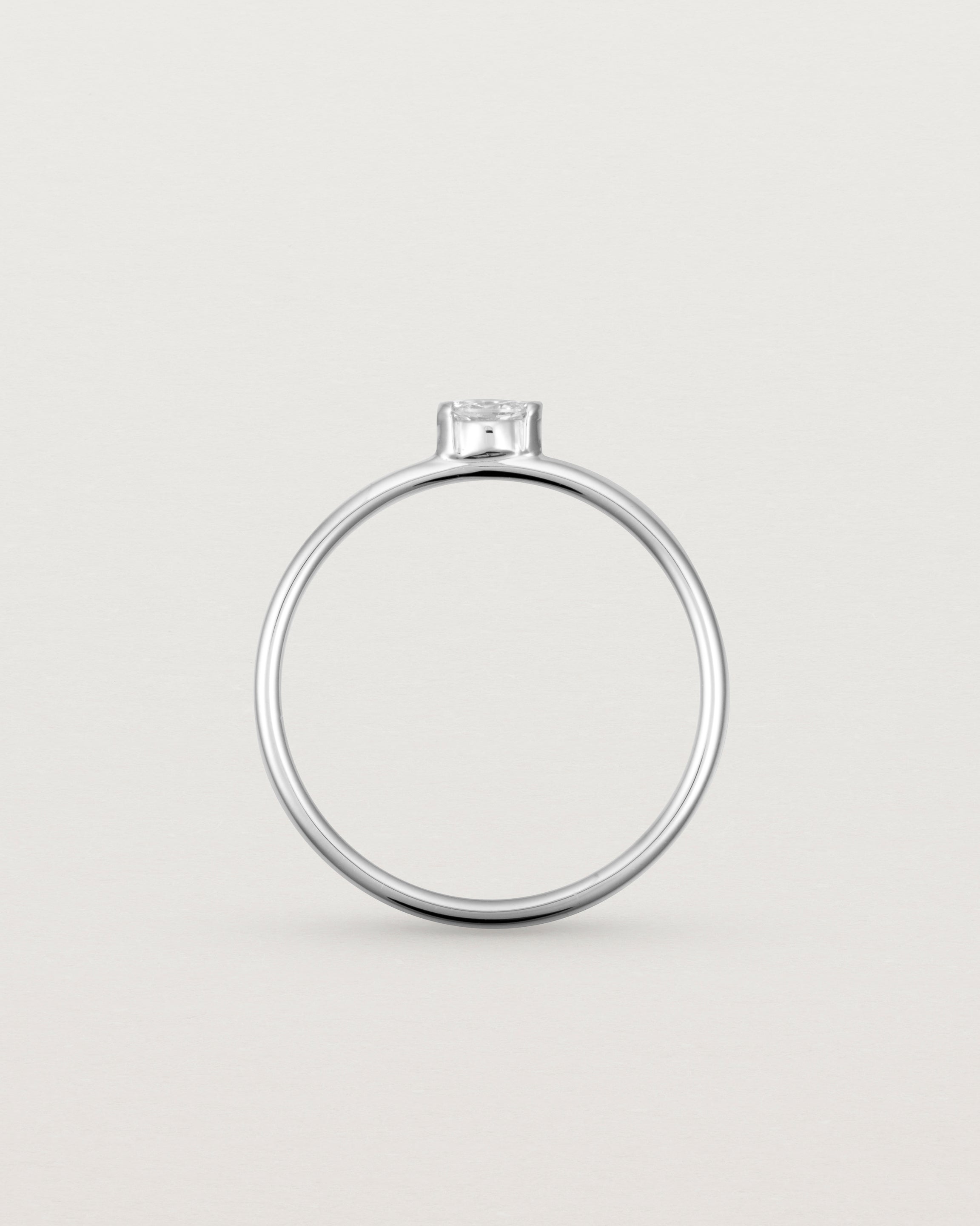 Fine white gold stacking ring featuring a white marquise centre diamond