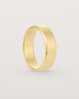 Standing view of the Chamfered Wedding Ring | 6mm in Yellow Gold.