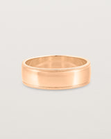 Front view of the Millgrain Wedding Ring | 6mm in Rose Gold.